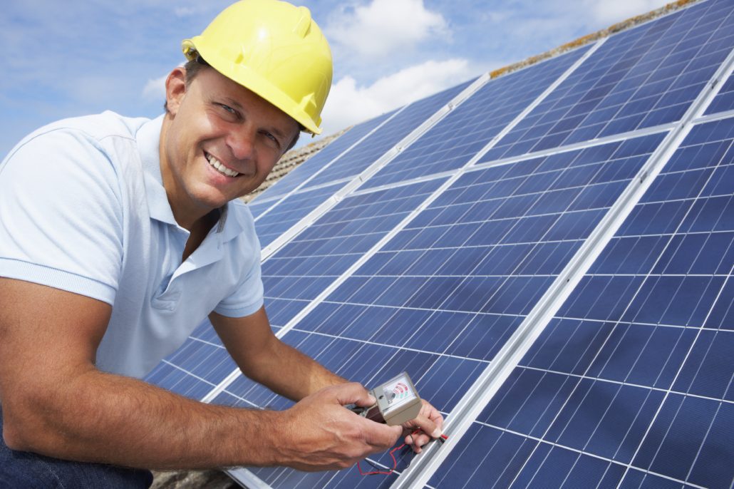 Man installing solar panels